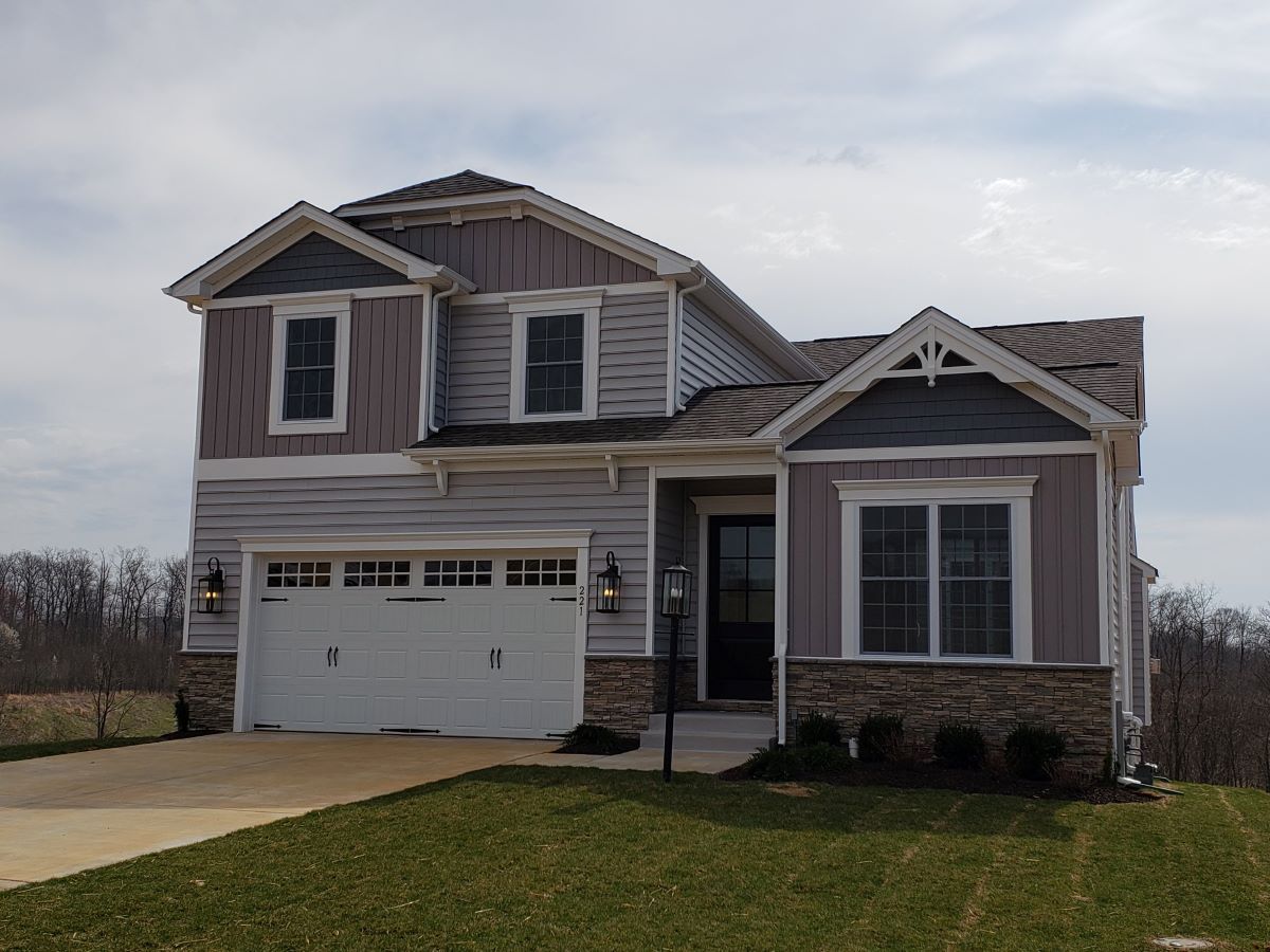 Fron of residential home with beige siding
